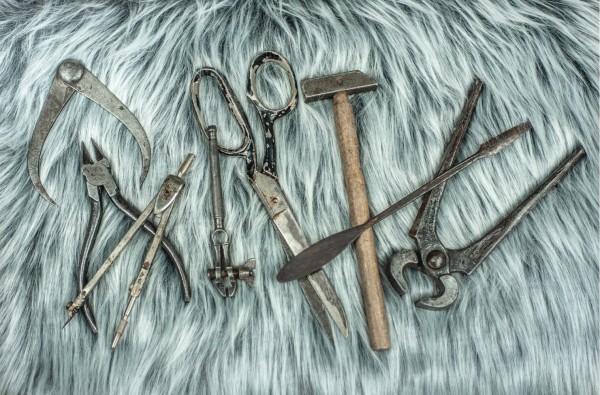 Some of the hand tools we use regularly at work displayed on grey faux fur