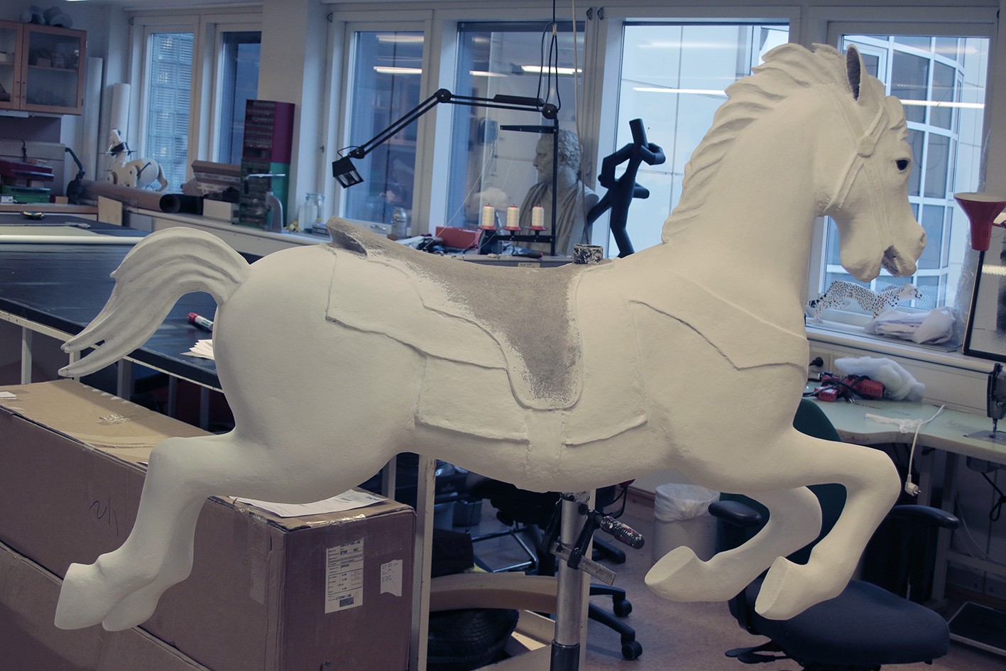 A tivoli-horse painted with white base color at a studio