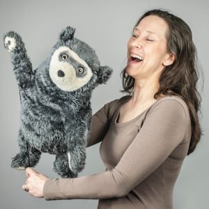 A portrait of Tiina and a waving Bo Bear
