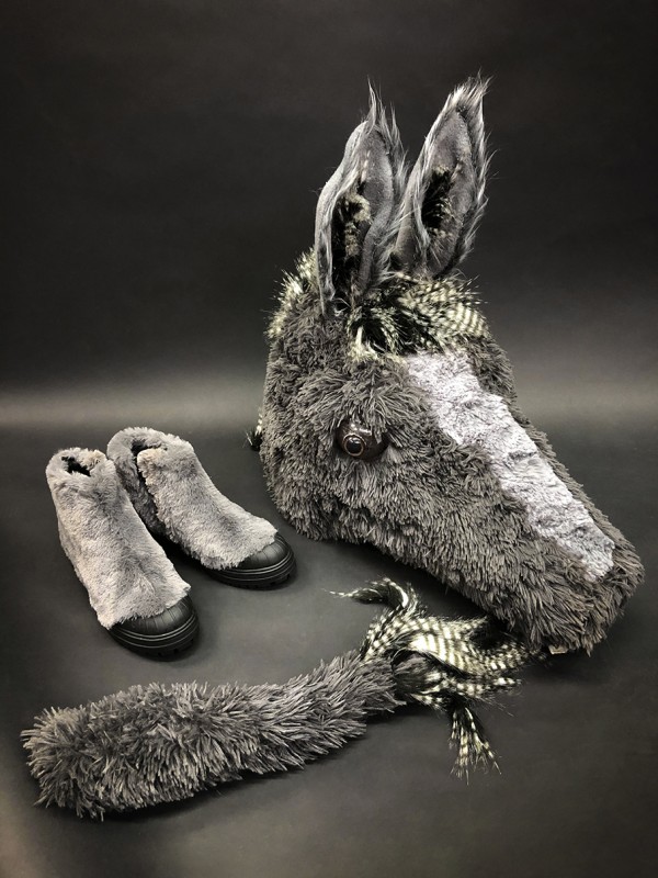 The donkey figure’s tail, shoes and head